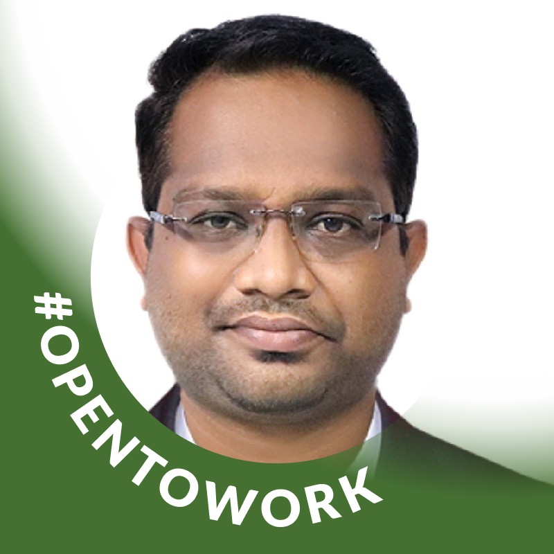 An indian man with glasses and a green background with the words openwork.